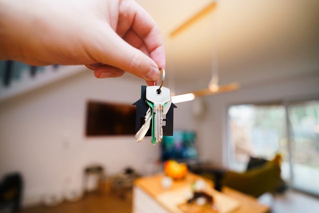 person-holding-house-keys